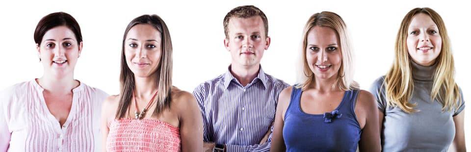 Five smiling people side by side against a light background